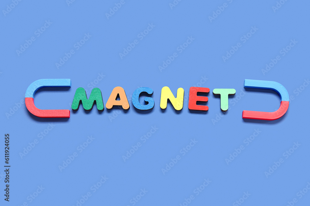 Horseshoe shaped magnets with word MAGNET on blue background