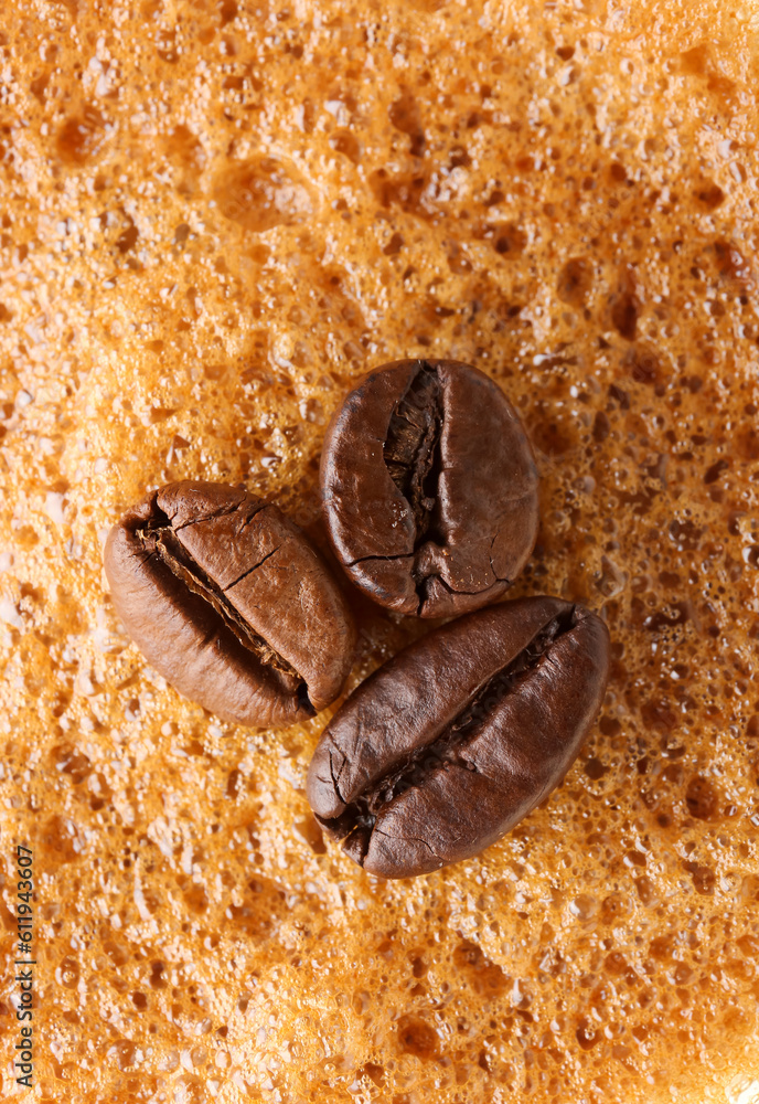 Texture of coffee foam and beans, closeup