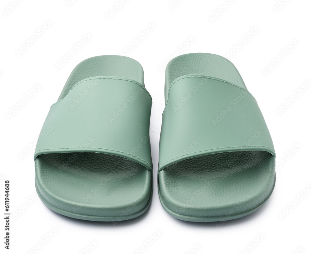 Pair of stylish green flip-flops on white background