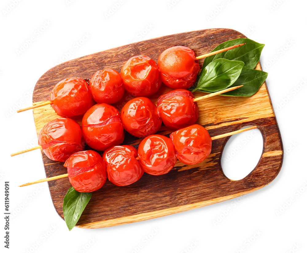 Board of skewers with tasty grilled tomatoes on white background