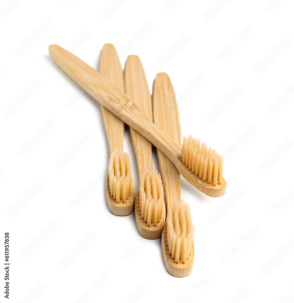 Many bamboo toothbrushes on white background