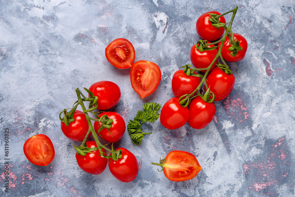 Fresh cherry tomatoes on blue background