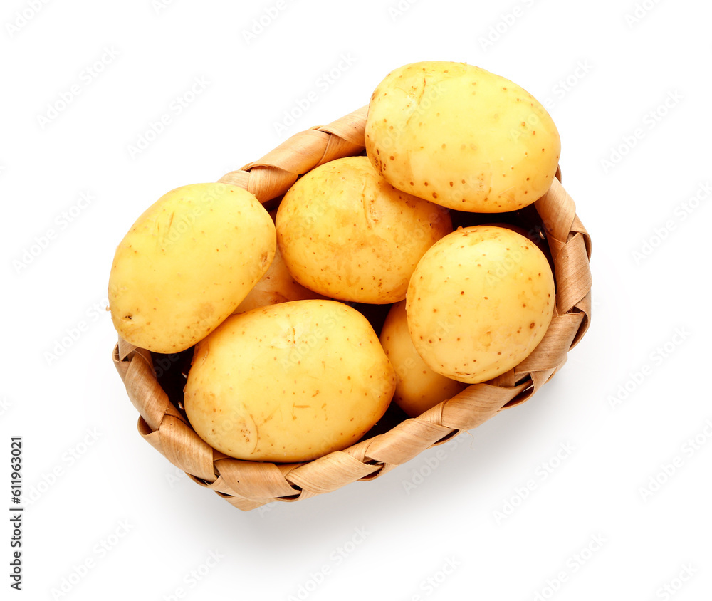 Wicker basket with raw baby potatoes on white background