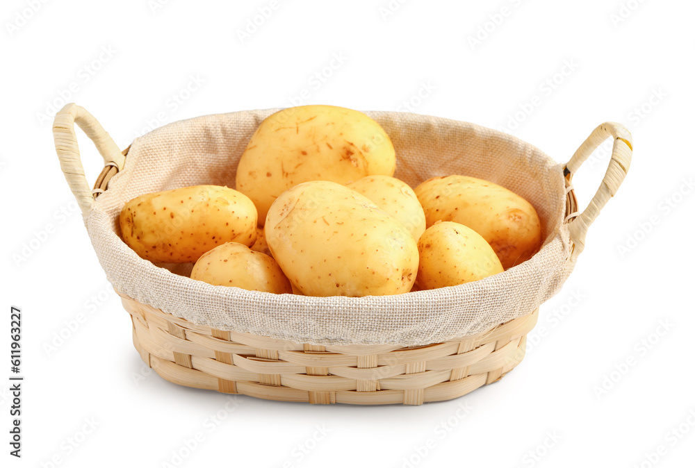 Wicker basket with raw baby potatoes on white background