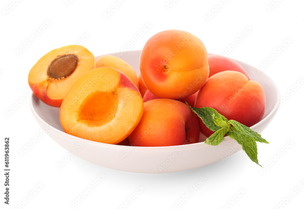 Bowl with ripe apricots isolated on white background