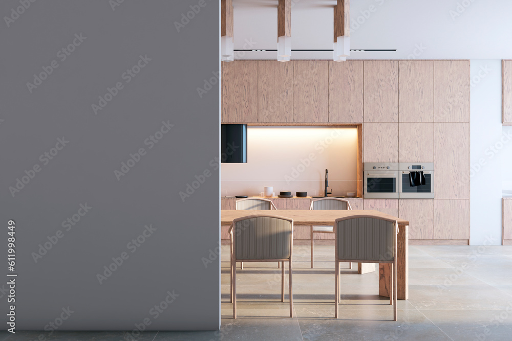 Front view of blank grey wall with place for image frame or poster in a modern kitchen interior with