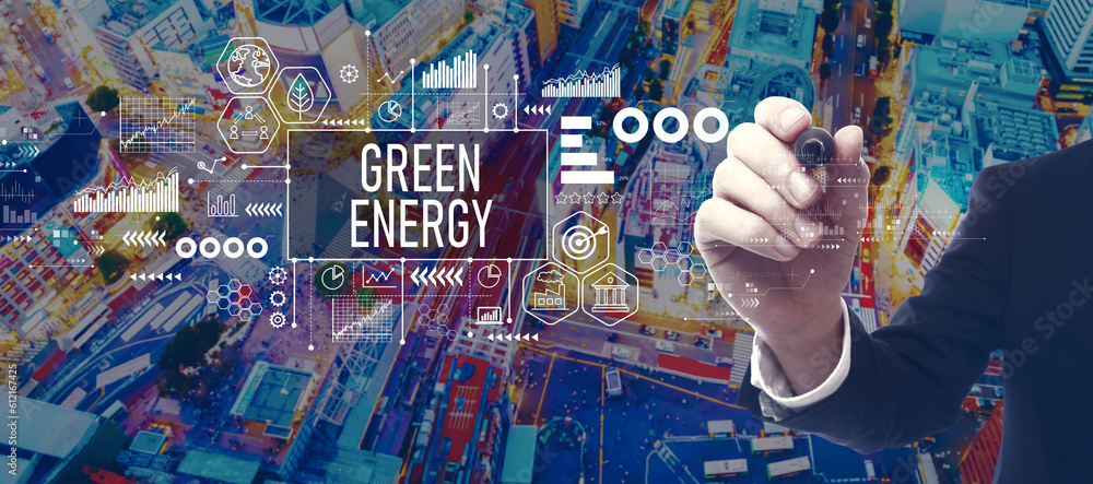 Green Energy concept with businessman in a city at night