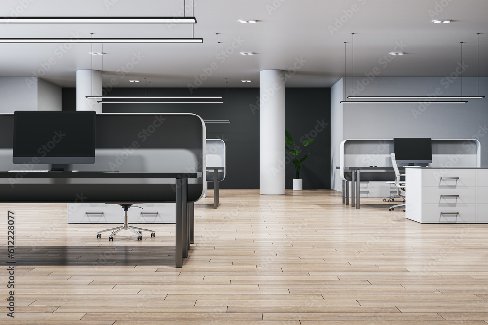 Contemporary coworking office interior with furniture, empty computer monitors and wooden flooring. 