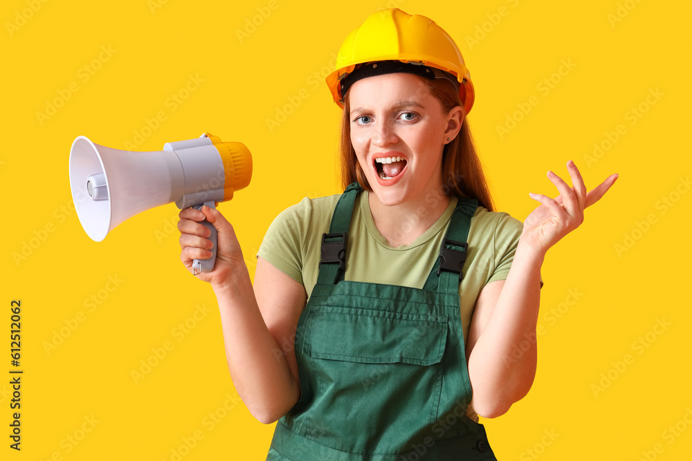 Female builder shouting into megaphone on yellow background