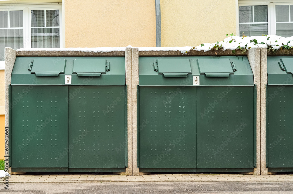 View of big garbage containers in city on winter day