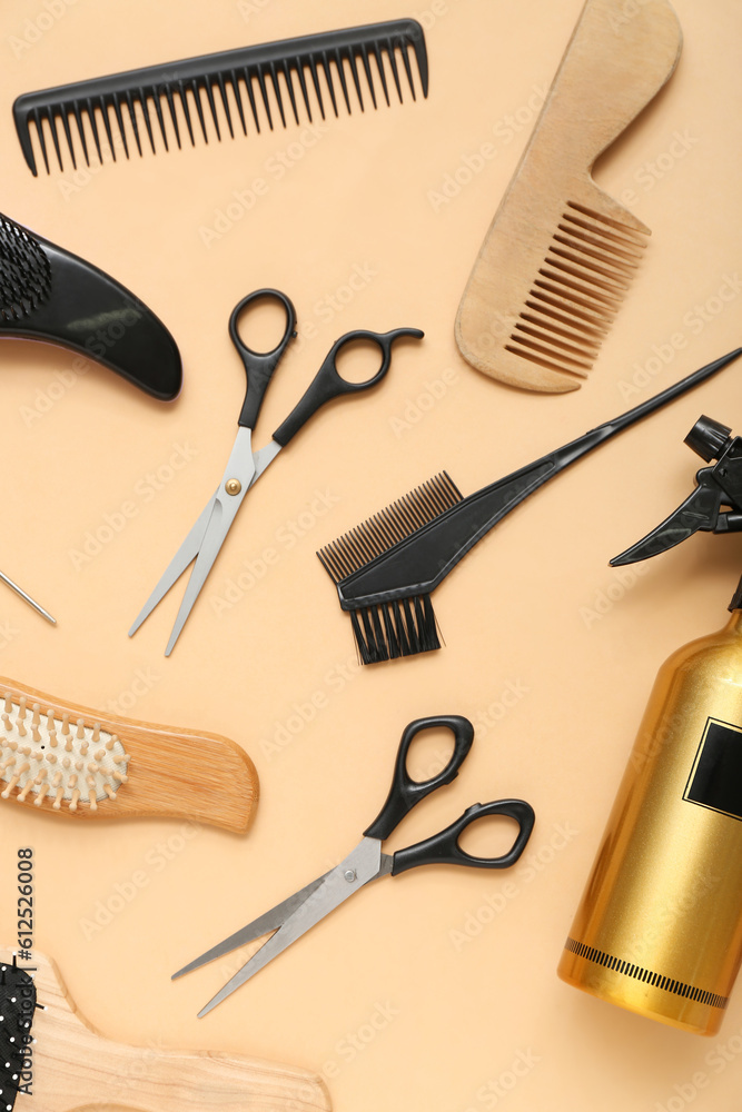 Composition with hairdressing accessories on beige background