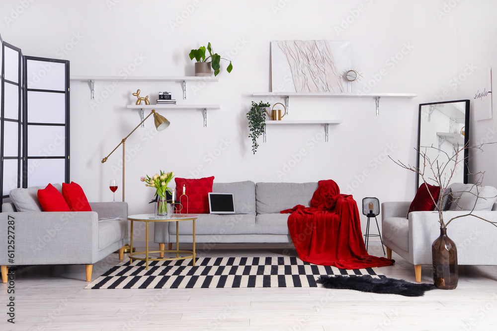 Interior of stylish living room with cozy sofas and coffee table