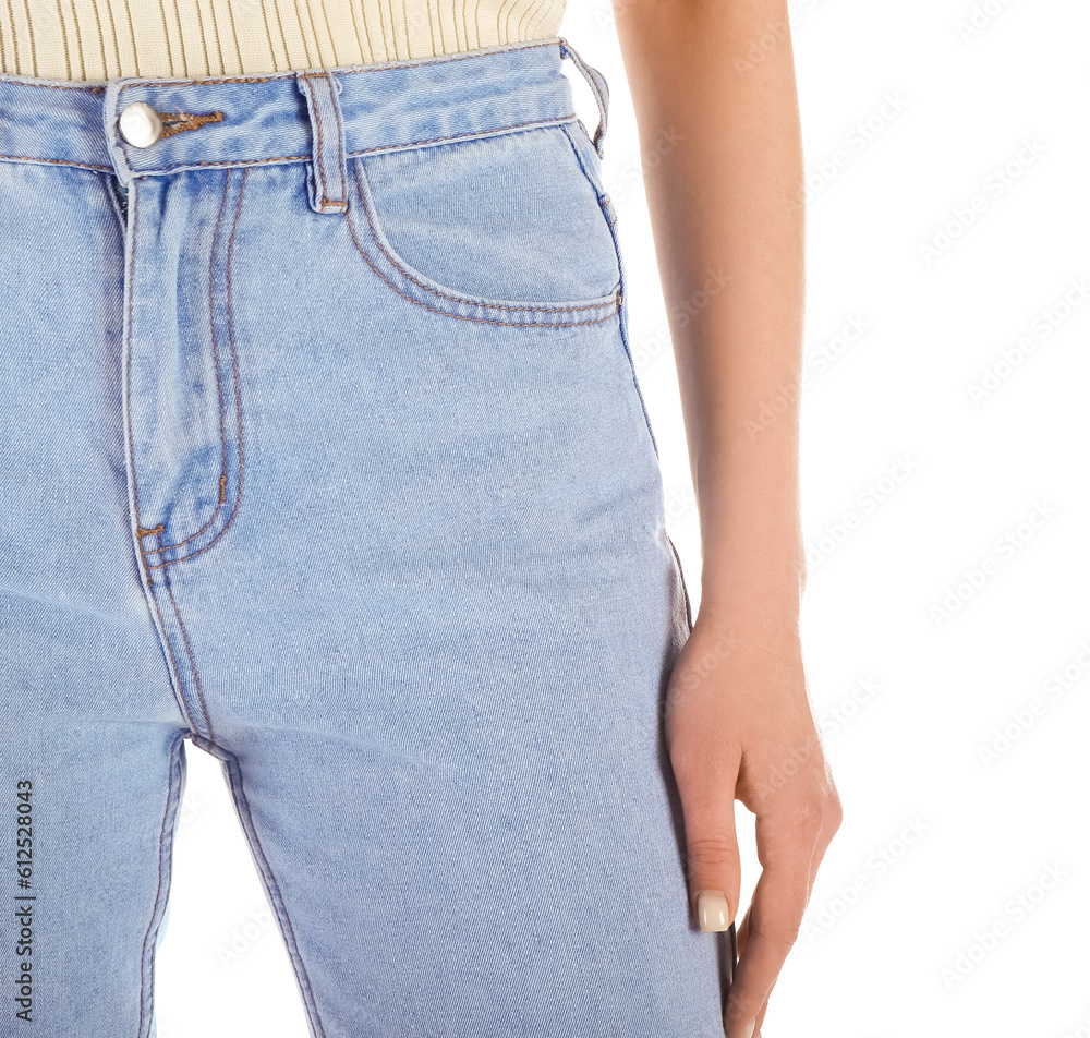 Young woman in stylish jeans on white background, closeup