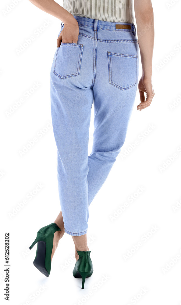 Young woman in stylish jeans on white background, back view