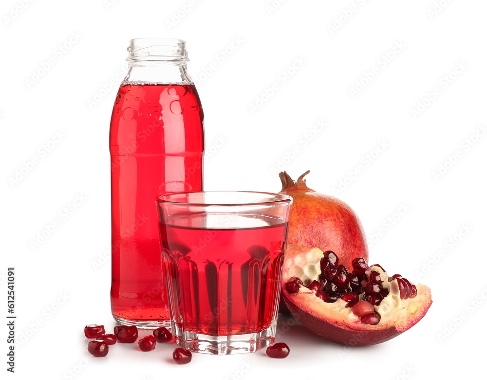 Glass and bottle of fresh pomegranate juice on white background