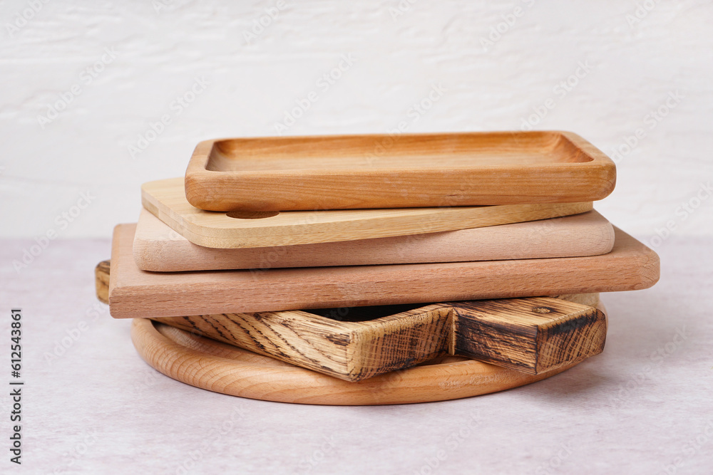 Different wooden cutting boards on white background