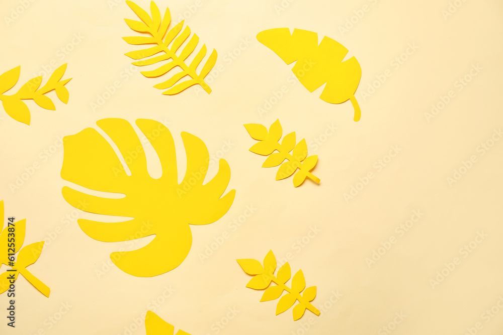 Beautiful origami leaves on beige background