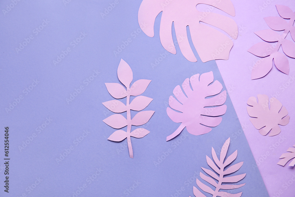 Beautiful origami leaves on purple background