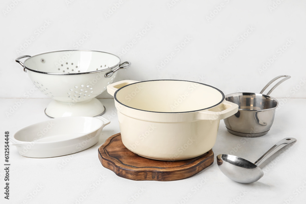 Set of different kitchen utensils on light background