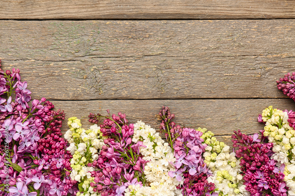 Lilac twigs on wooden background