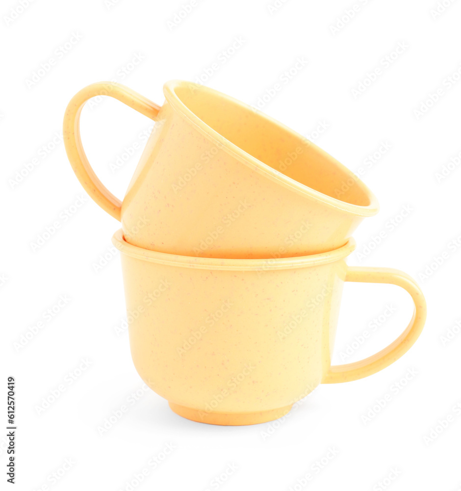 Orange cups isolated on white background. Childrens Day celebration