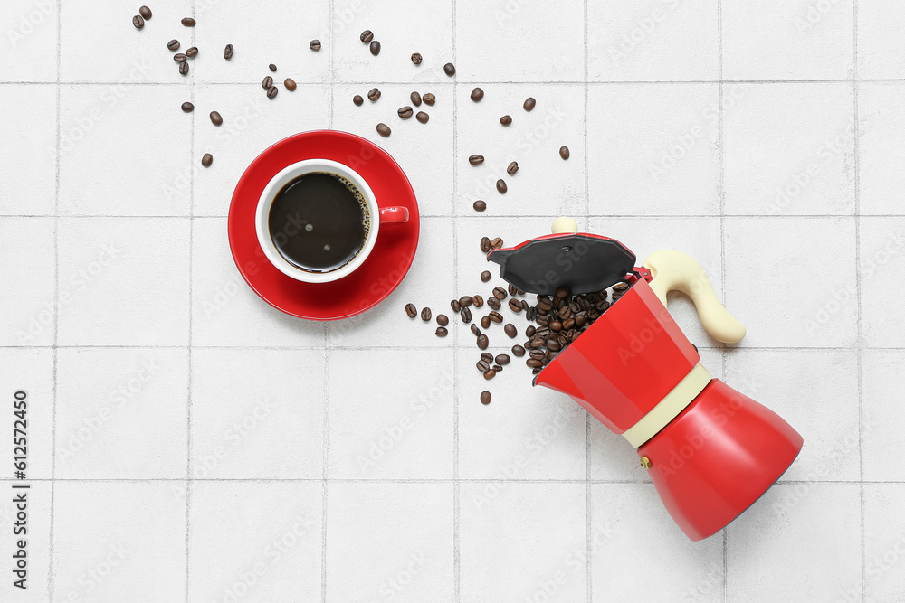 Cup of hot espresso and geyser coffee maker on white tile background