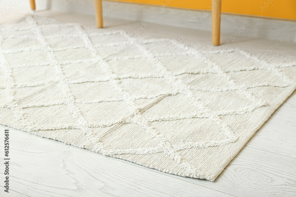 Soft rug on floor in living room, closeup