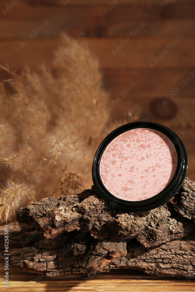 Composition with highlighter, tree bark and pampas grass on wooden background, closeup