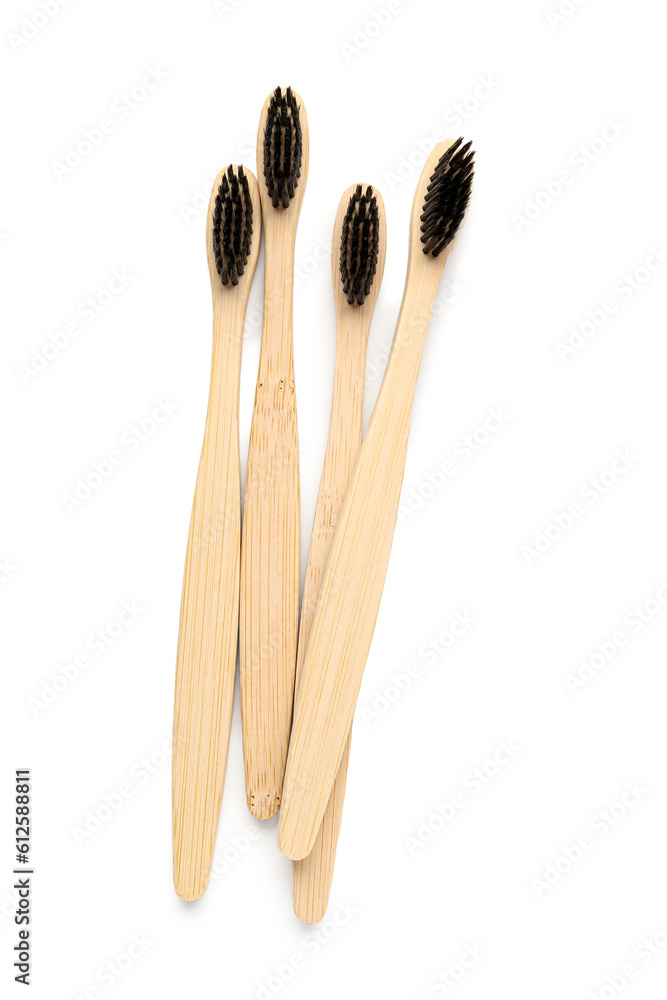 Many bamboo toothbrushes on white background