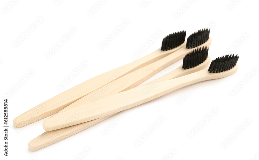 Many bamboo toothbrushes on white background