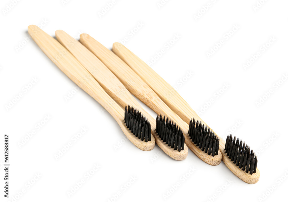 Many bamboo toothbrushes on white background