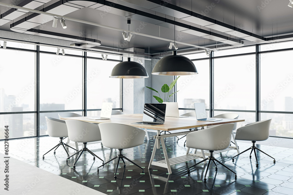 Perspective view of a comfortable workplaces in a modern open loft office interior with desks, compu