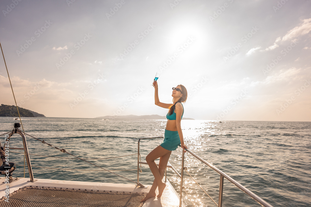 Caucasian woman in bikini drink champagne while having party in yacht. 