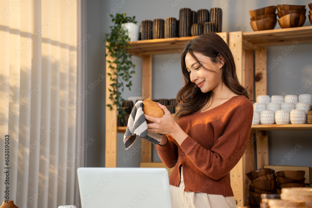 Caucasian young woman packing vase goods order into box for customer. 