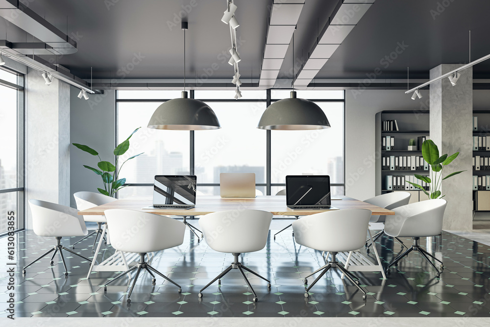 Front view of a comfortable workplaces in a modern open loft office interior with desks, computers, 