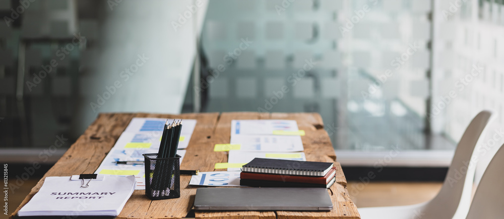 Business meeting minutes papers on wooden table in office.