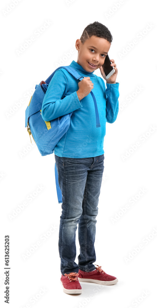 Little African-American student talking by phone on white background