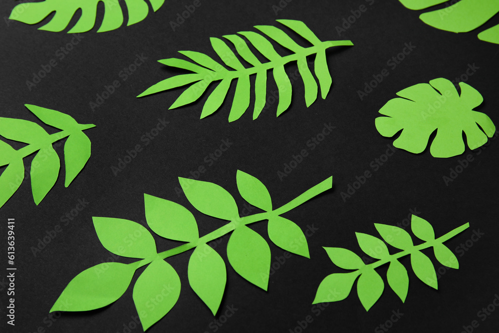 Beautiful origami leaves on dark background