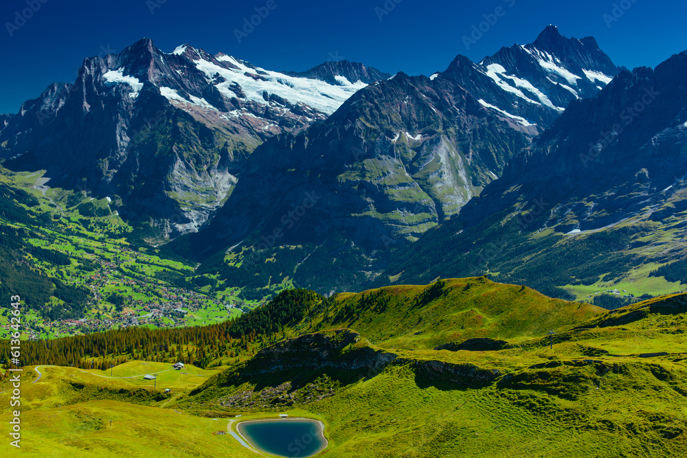 Swiss Alps mountains with lake in summer