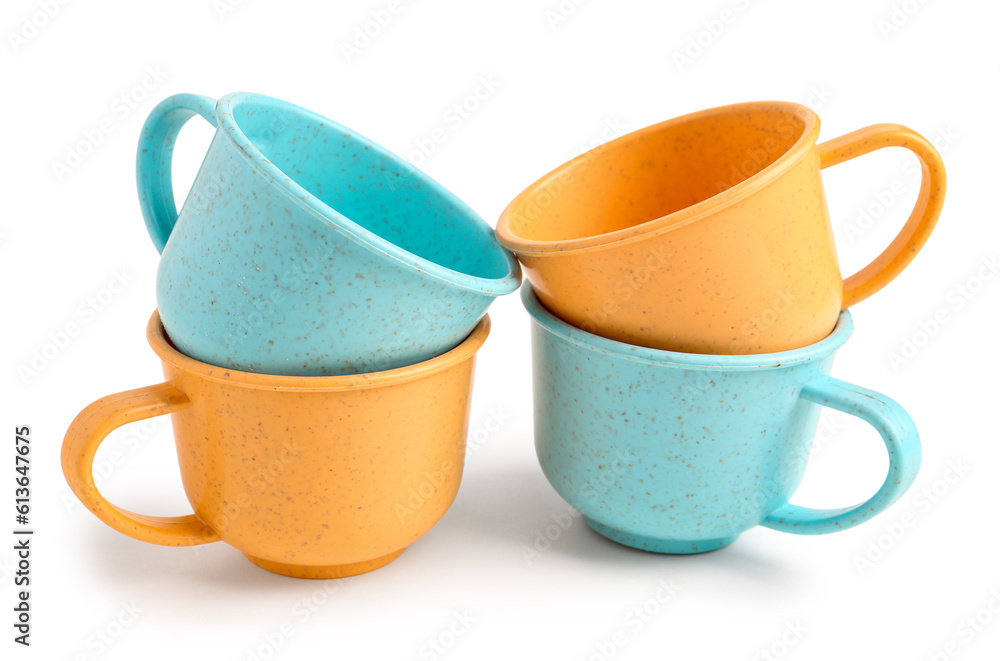 Colorful cups isolated on white background. Childrens Day celebration