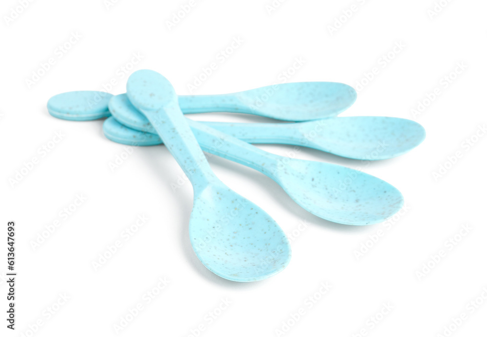 Blue spoons isolated on white background. Childrens Day celebration