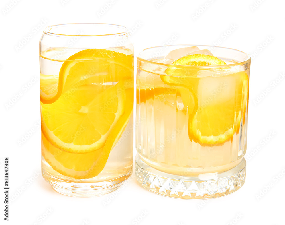 Glasses of infused water with orange slices on white background