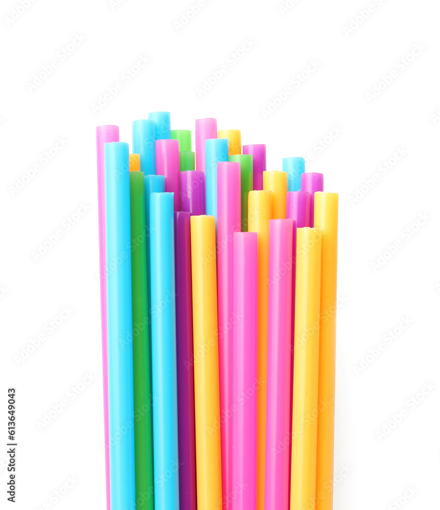 Different plastic straws on white background