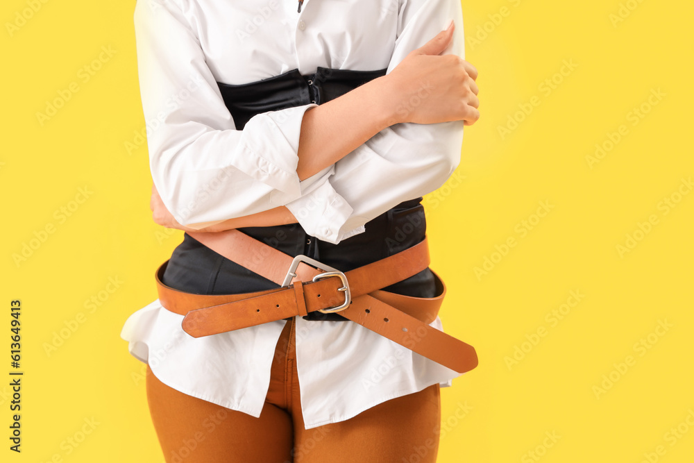 Beautiful cowgirl on yellow background, closeup