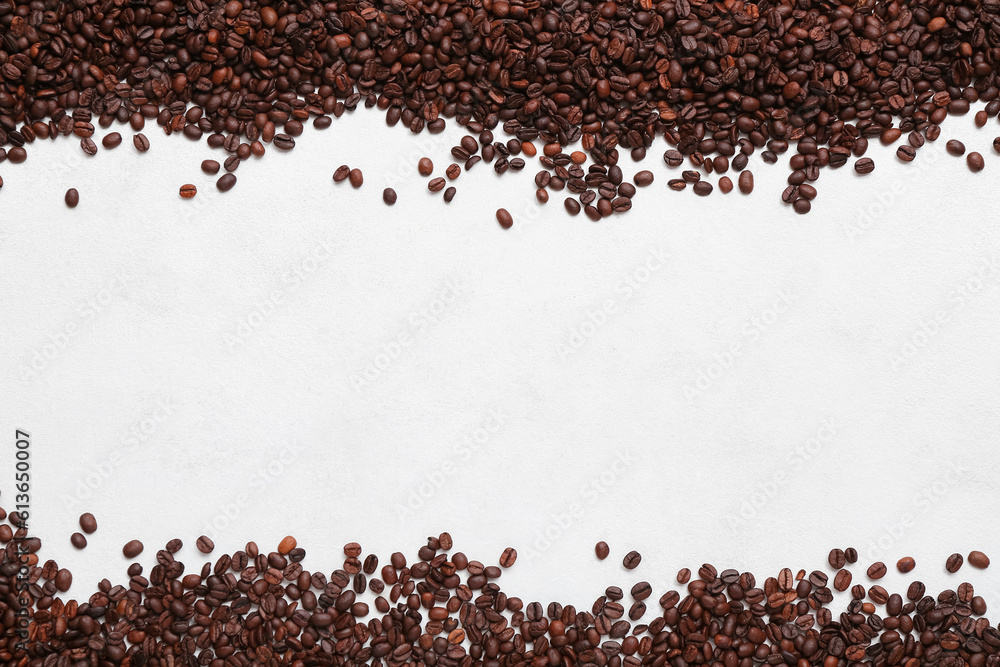 Frame made of coffee beans on light background