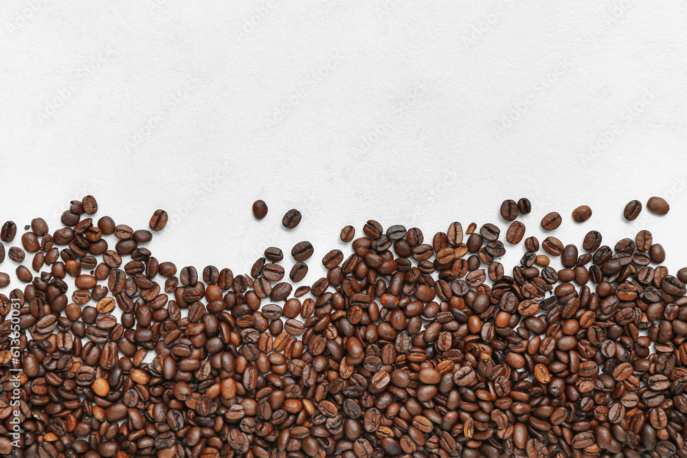 Frame made of coffee beans on light background