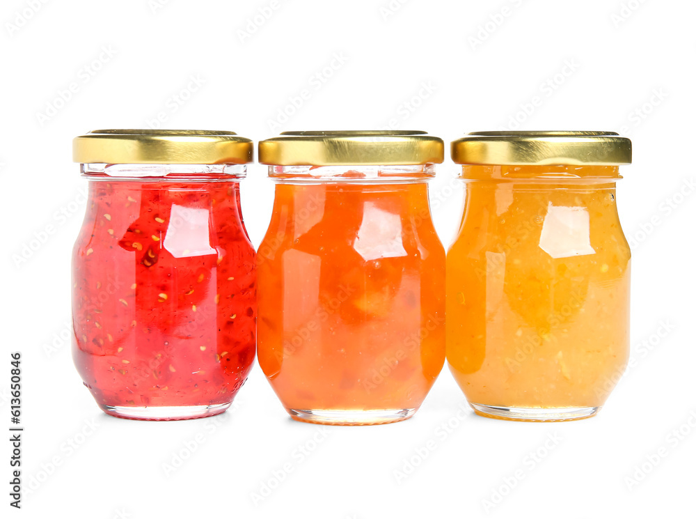 Jars of different jams on white background