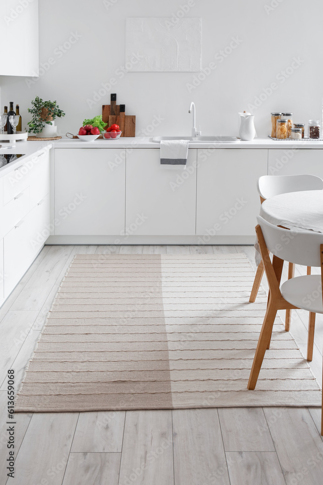 Stylish beige carpet in interior of modern kitchen