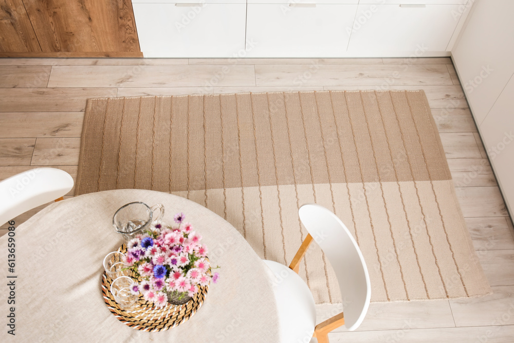 Stylish beige carpet in interior of modern kitchen