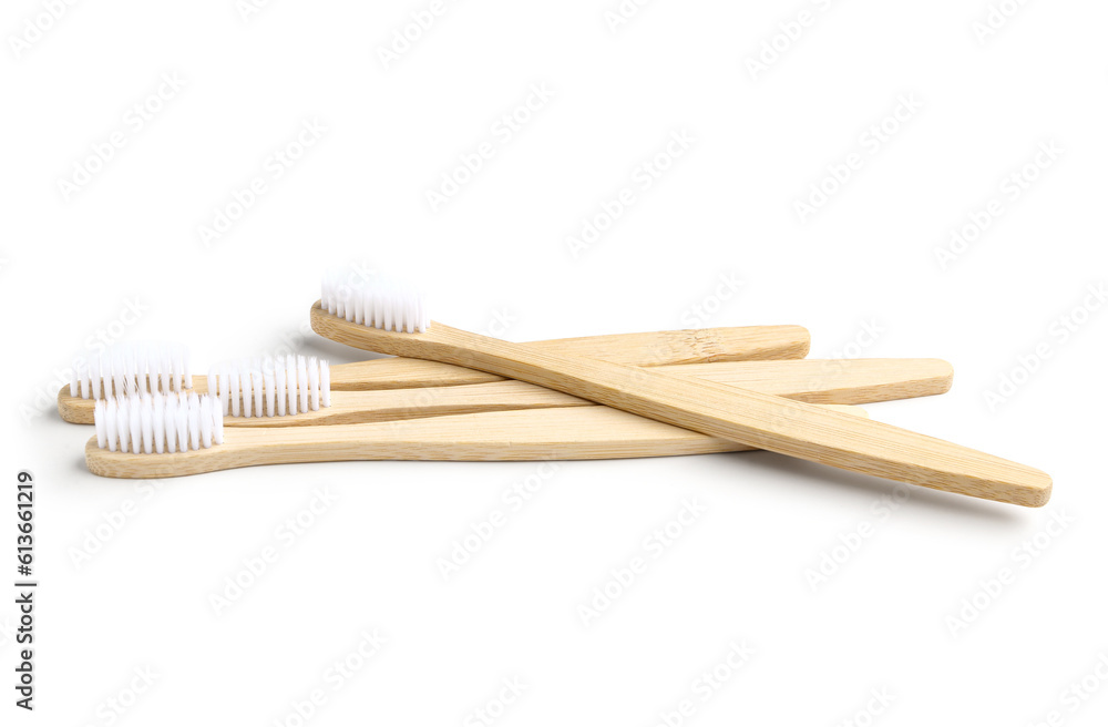 Many bamboo toothbrushes on white background